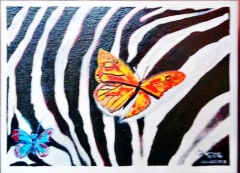Two butterflies on a zebra