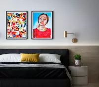Two paintings on a wall: a complementary color pattern and a portrait of a young woman