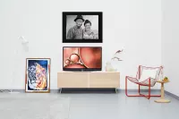 A painting of a couple on a wall and a paint of a lion on the floor